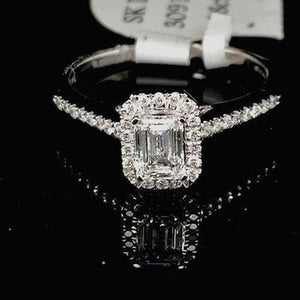 Emerald Cut Halo Style Ring With Diamond Set Shoulders