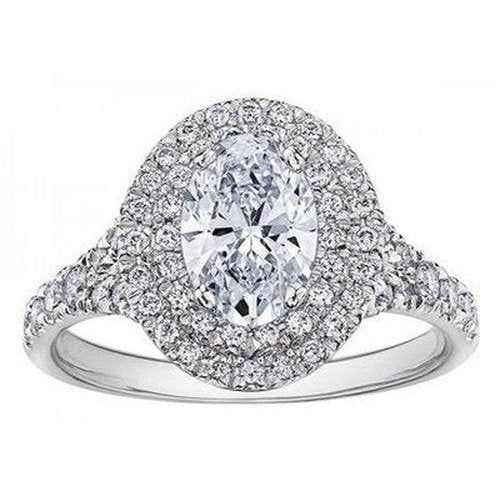 Oval Halo Style Solitaire with diamond shoulders .70ct